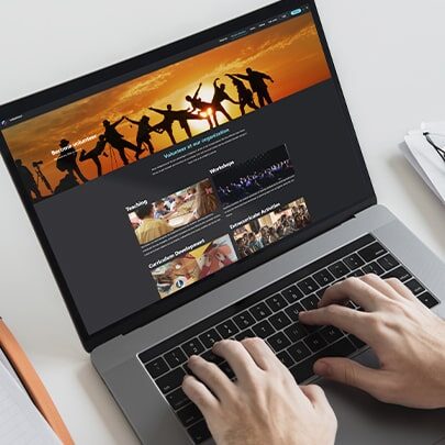 Volunteer Management Software on Laptop with a Man Typing