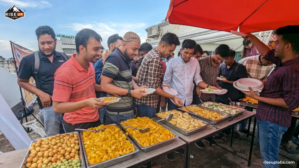 Team members taking delicious fruits on their plate at fruit festival