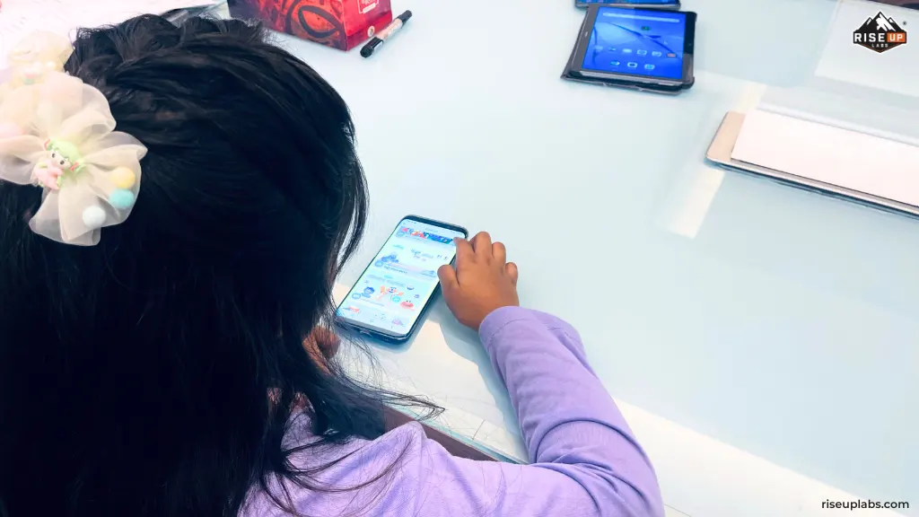 A children playing games on Sisimpur Mobile Apps